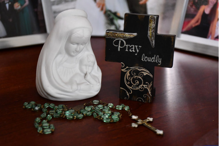 Madonna with rosary and cross engraved with "Pray Loudly"